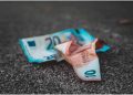 Crunched pounds on the floor representing the impact of inflation