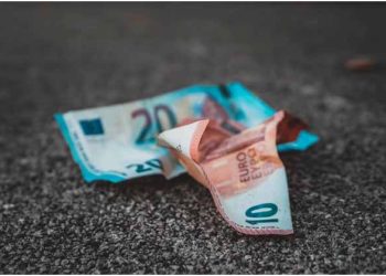 Crunched pounds on the floor representing the impact of inflation