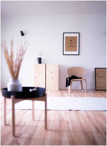 A minimal living room with some metal vases